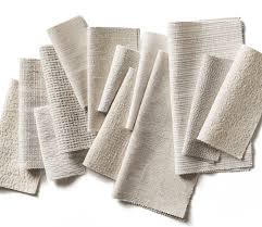 Several sheets of printed text scattered and overlapping on a white surface.