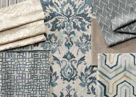 Fabric samples with intricate patterns and textures in neutral and blue tones.