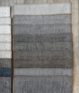 A textured concrete wall with horizontal patterns in shades of gray.