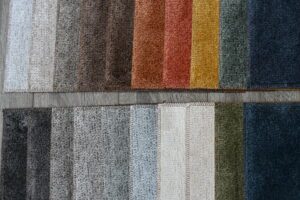 Various fabric swatches in warm and neutral tones.
