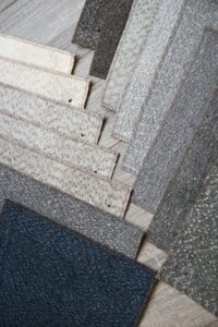 Close-up of various textured stone surfaces arranged geometrically.